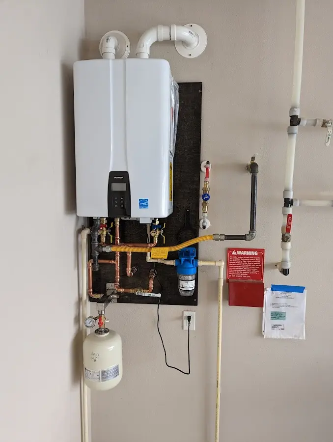 Professional plumber installing copper piping in a Hampshire home